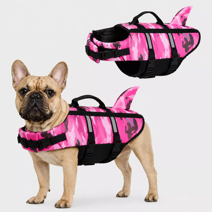 Dog wearing life jacket a pink and black camouflage life jacket on a white background