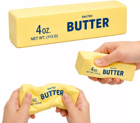 Butter squishy slow rise foam toy shaped like a realistic stick of salted butter on a white background