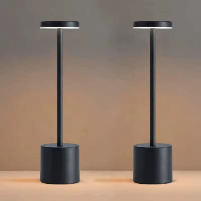 Two Cordless table lamps illuminating a table in a cozy room. Best rechargebla lamp no cords