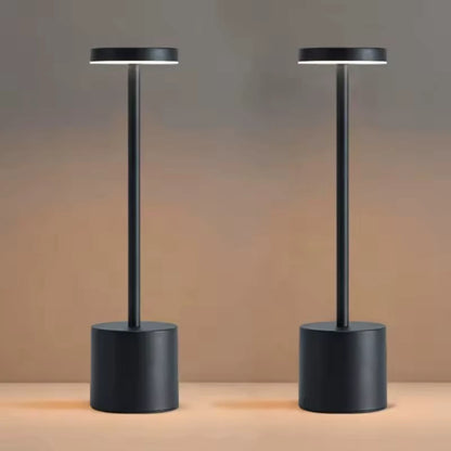 Two Cordless table lamps illuminating a table in a cozy room. Best rechargebla lamp no cords