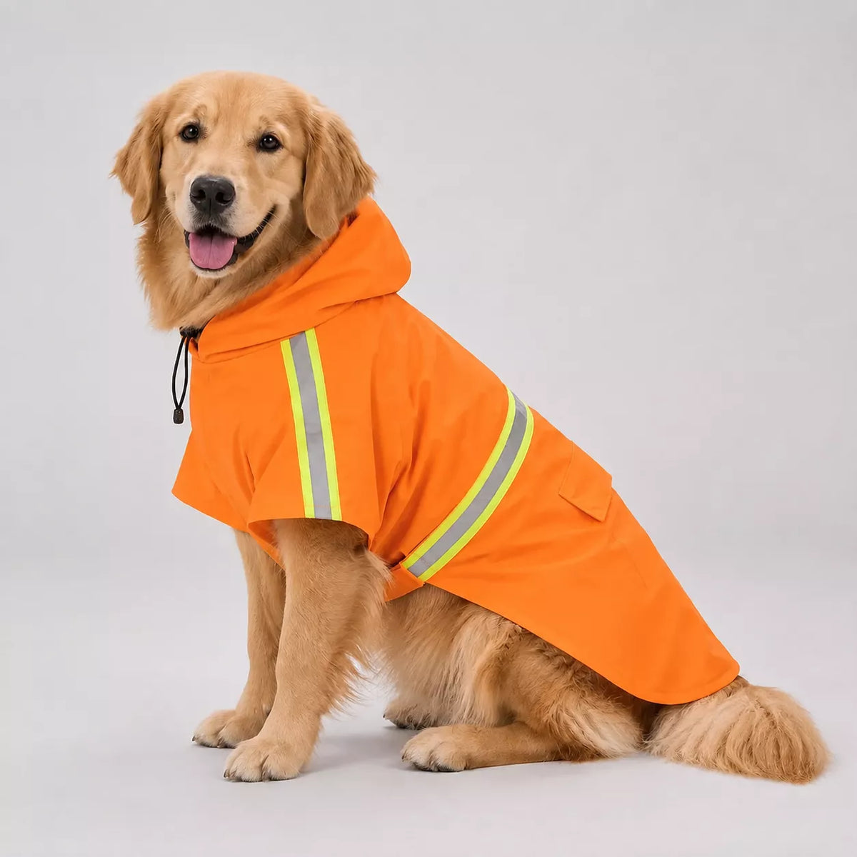 A dog wearing a bright orange dog raincoat with reflective yellow and silver stripes, sitting against a light gray studio background.