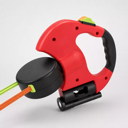 Close-up of dual dog leash handle showing color-coded brake buttons and 360-degree swivel detail