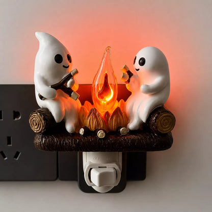 Ghost campfire night light glowing from a wall outlet