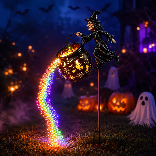 Lighted witch garden stake outdoor Halloween decoration in a garden
