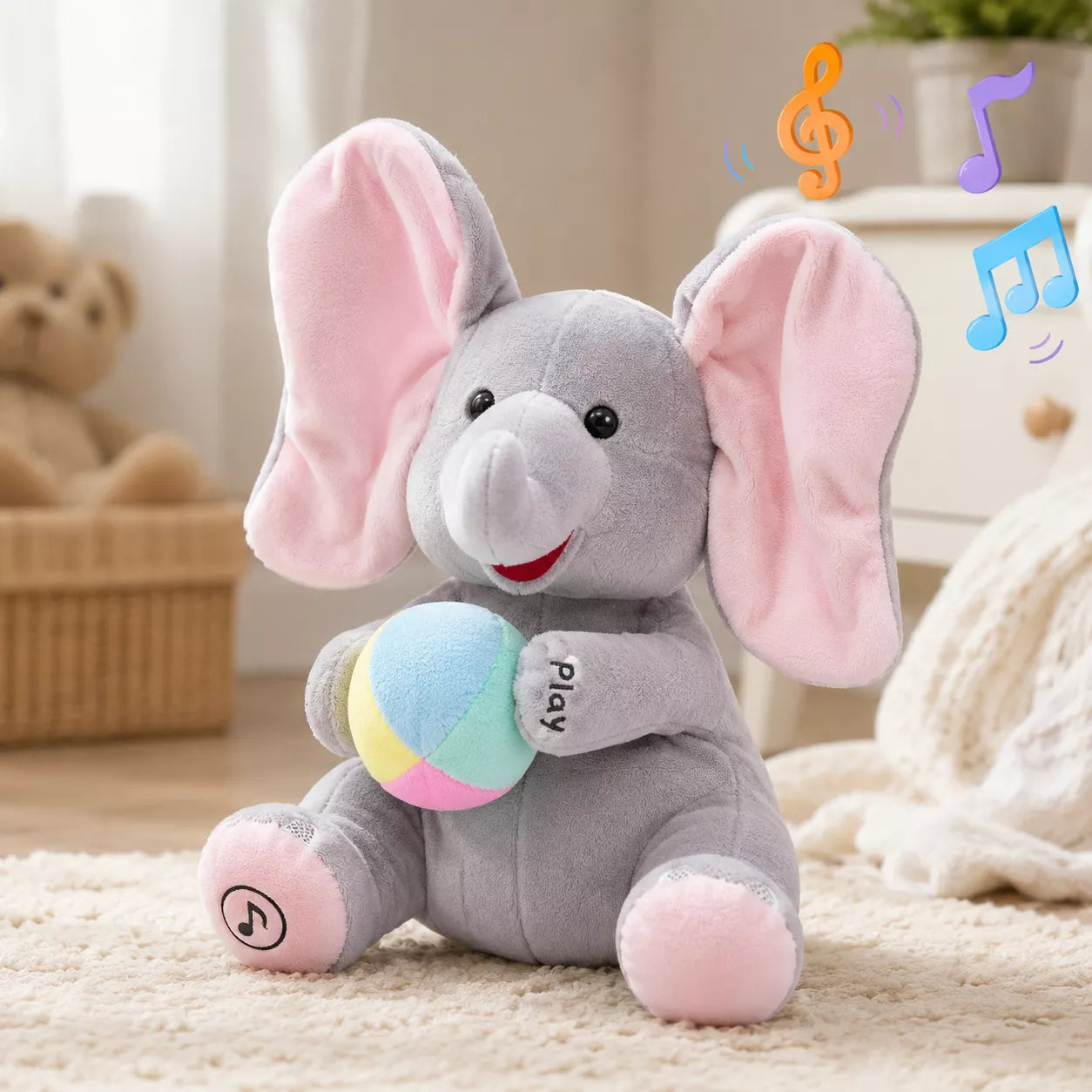 Singing elephant toy with ears raised during interactive peekaboo play