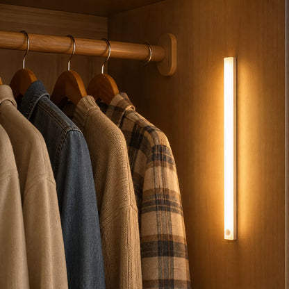 Slim rechargeable motion sensor light bar mounted in bedroom closet
